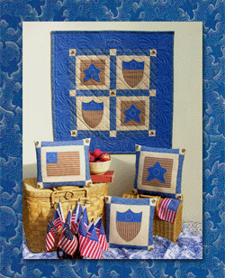 "Liberty" Collection - Pattern # Q10 - This patriotic quilt is dedicated to two of my ancestral grandfathers (seven generations back), Isaac Waggoner and John Padgett, good friends who served together in the South Carolina militia during the Revolutionary War.  They, like thousands of others, helped assure the liberties we enjoy today.  The stars are embroidered on a faded blue fabric and combined with a reproduction blue print, tea-dyed muslin, and tea-dyed red stripes.  The crests, large stars and blue corners of the flag, are decorated with blanket stitches to give the quilt the look of age.  By the way, after the war Isaac’s son, John, married John Padgett’s daughter, Emsey, and the rest is, as they say, HISTORY. 